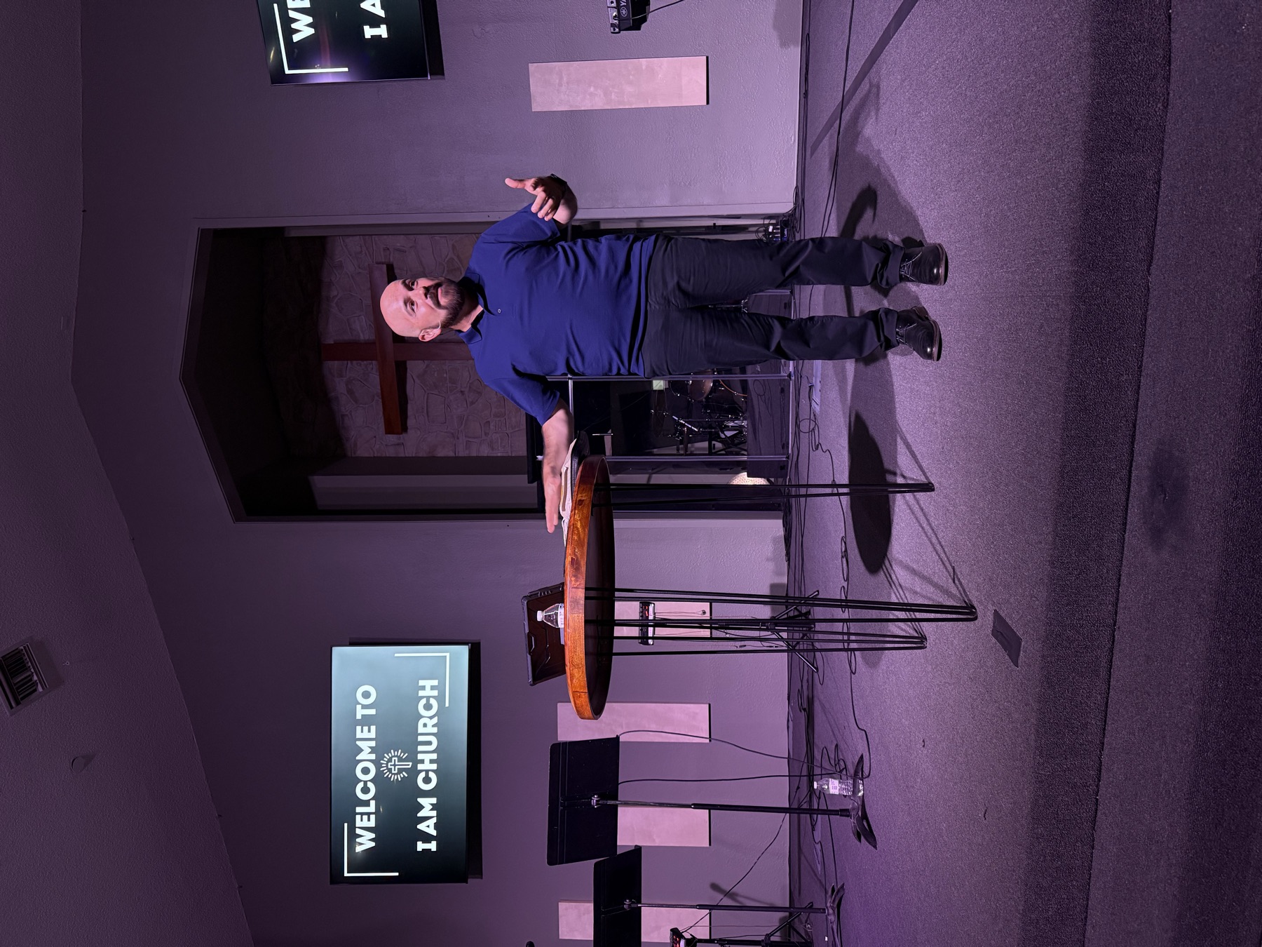Pastor teaching on stage at I AM Church